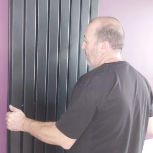 Paul Brett fitting a radiator